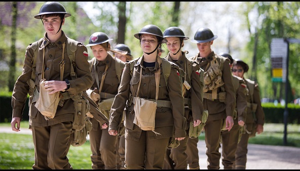 Teenagers dressed up as soldiers